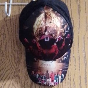 Graphic Black Cap with Red and Gold Design